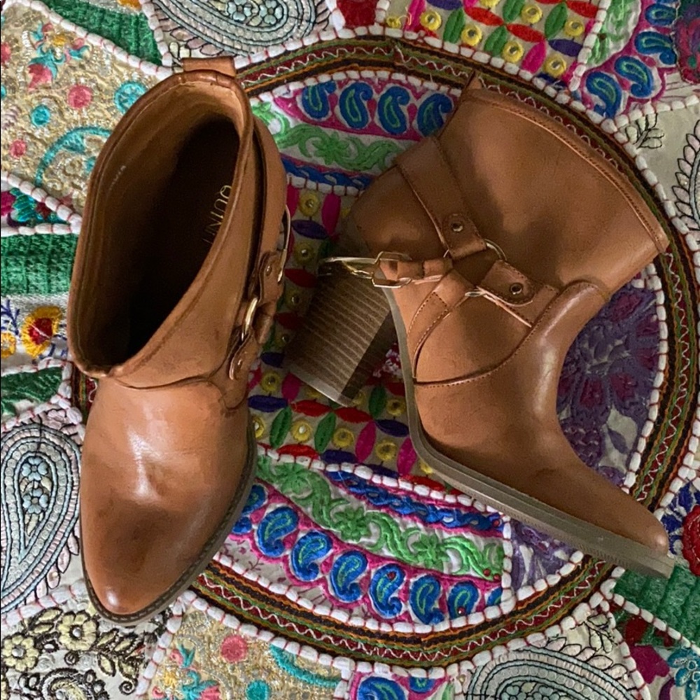 Brown booties with gold spurs